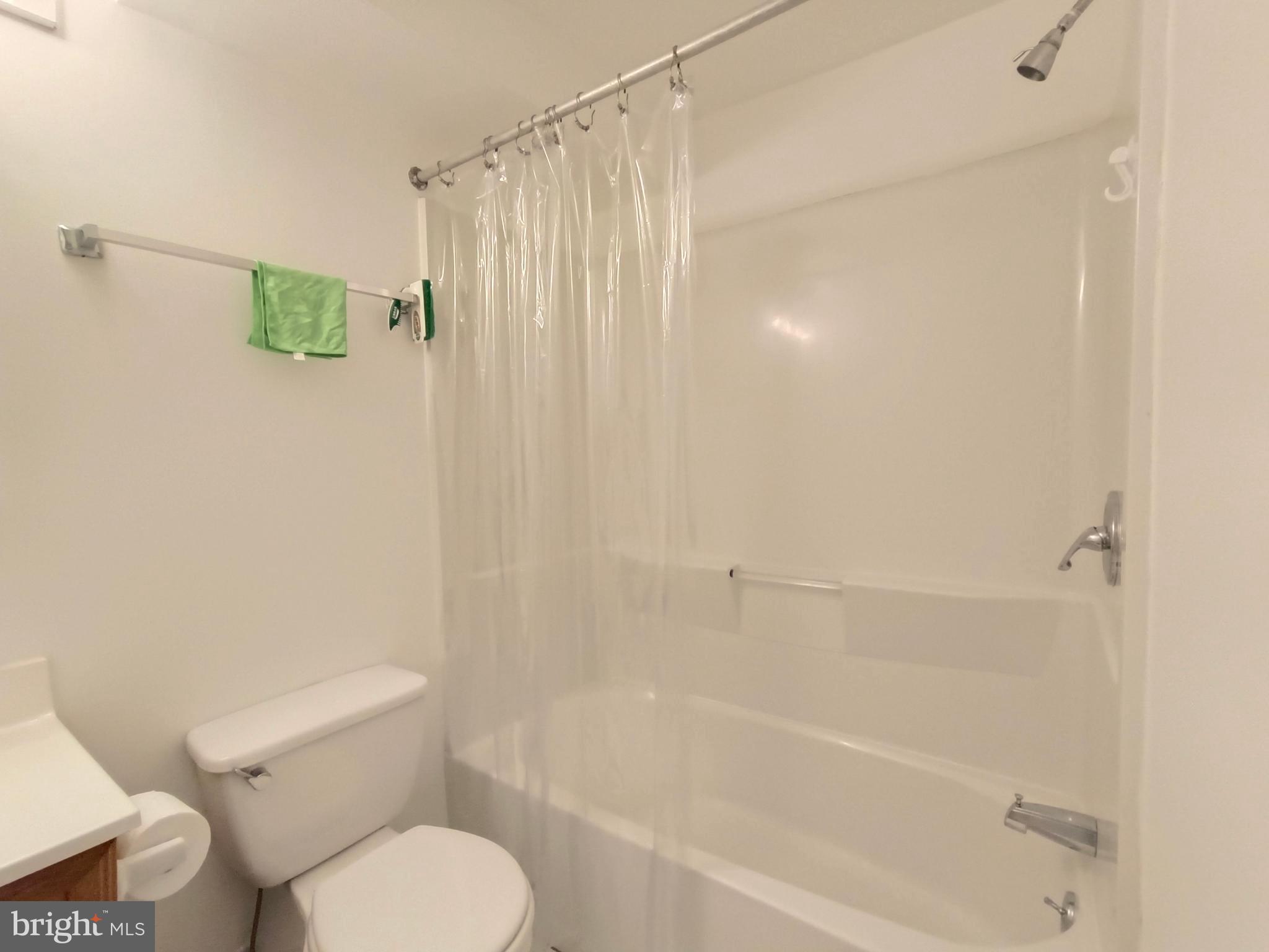 8835 Tuckerman Lane Potomac, MD 20854 - Photo 45 of 46 a bath room with a toilet and a bath tub