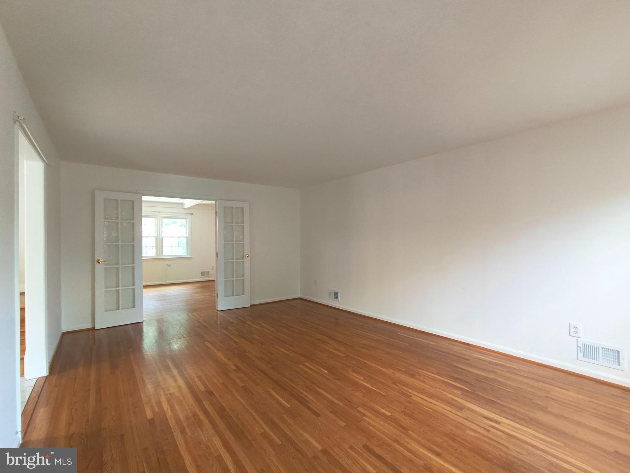 8835 Tuckerman Lane Potomac, MD 20854 - Photo 5 of 46 a view of an empty room and window