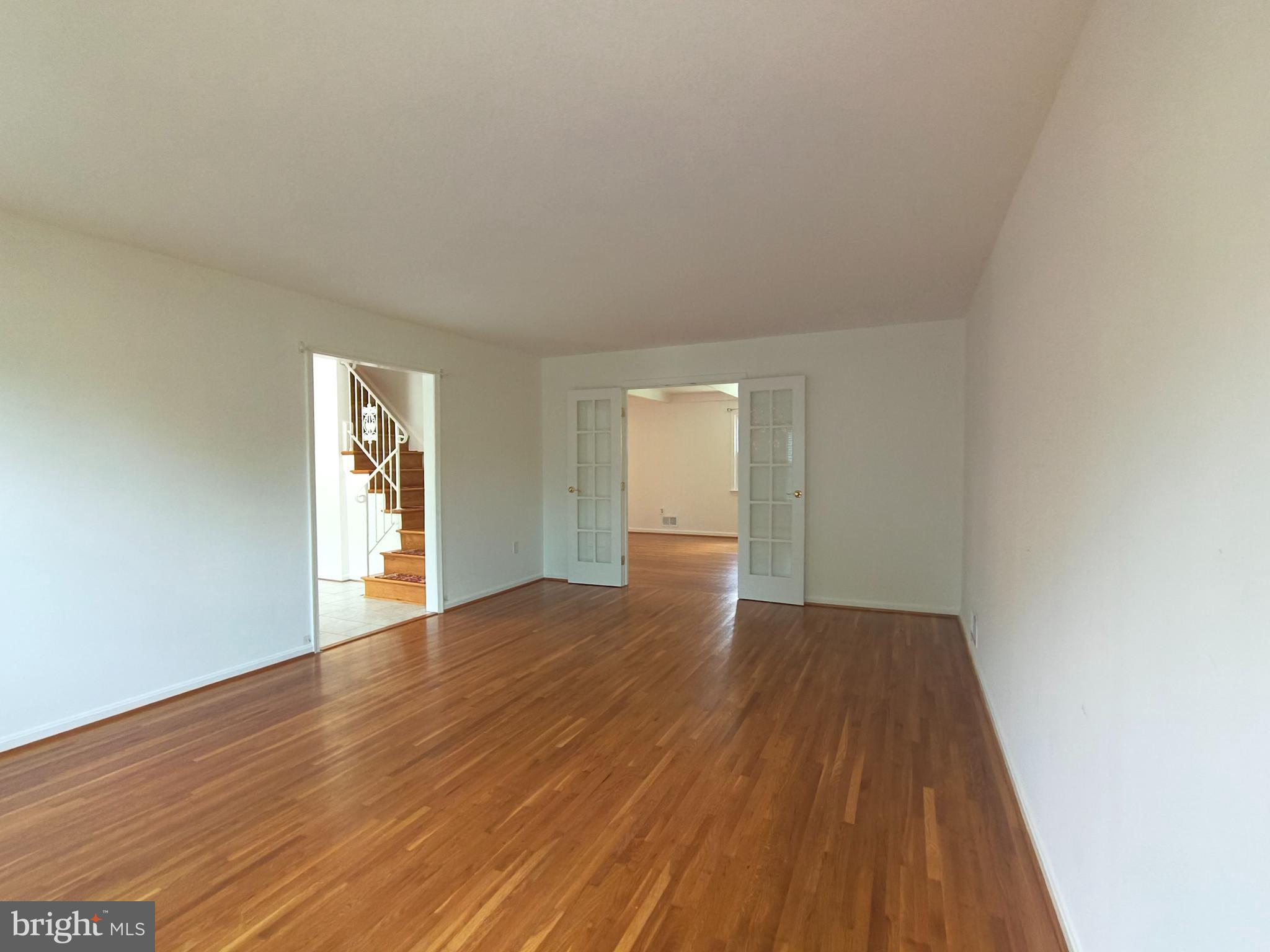 8835 Tuckerman Lane Potomac, MD 20854 - Photo 6 of 46 a view of an empty room and window