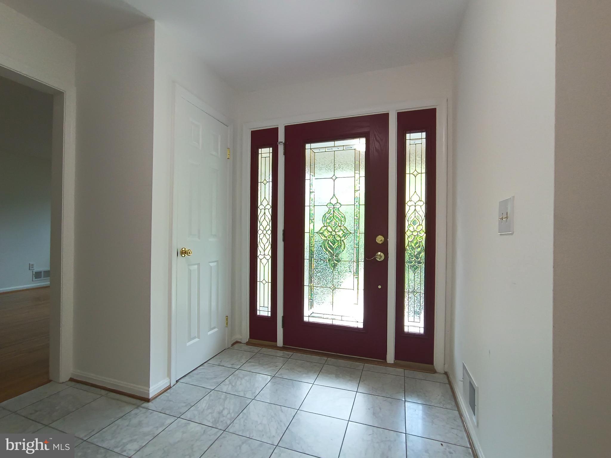 8835 Tuckerman Lane Potomac, MD 20854 - Photo 10 of 46 a view of an empty room with window