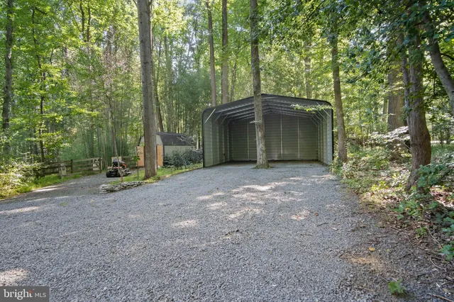a kitchen with sink and large window