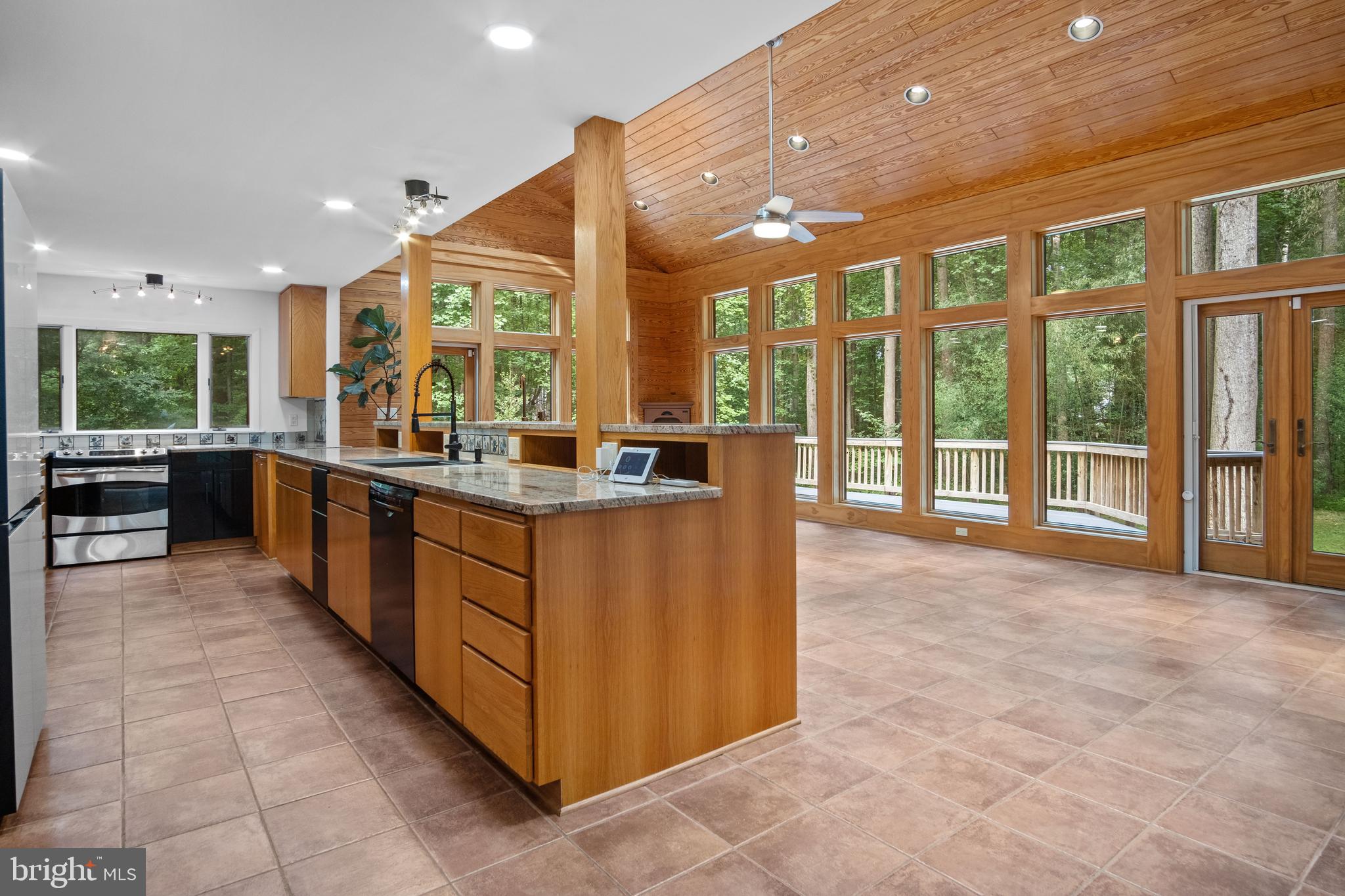 634 Springvale Road Great Falls, VA 22066 - Photo 24 of 67 a large kitchen with stainless steel appliances a large counter top a stove and a sink