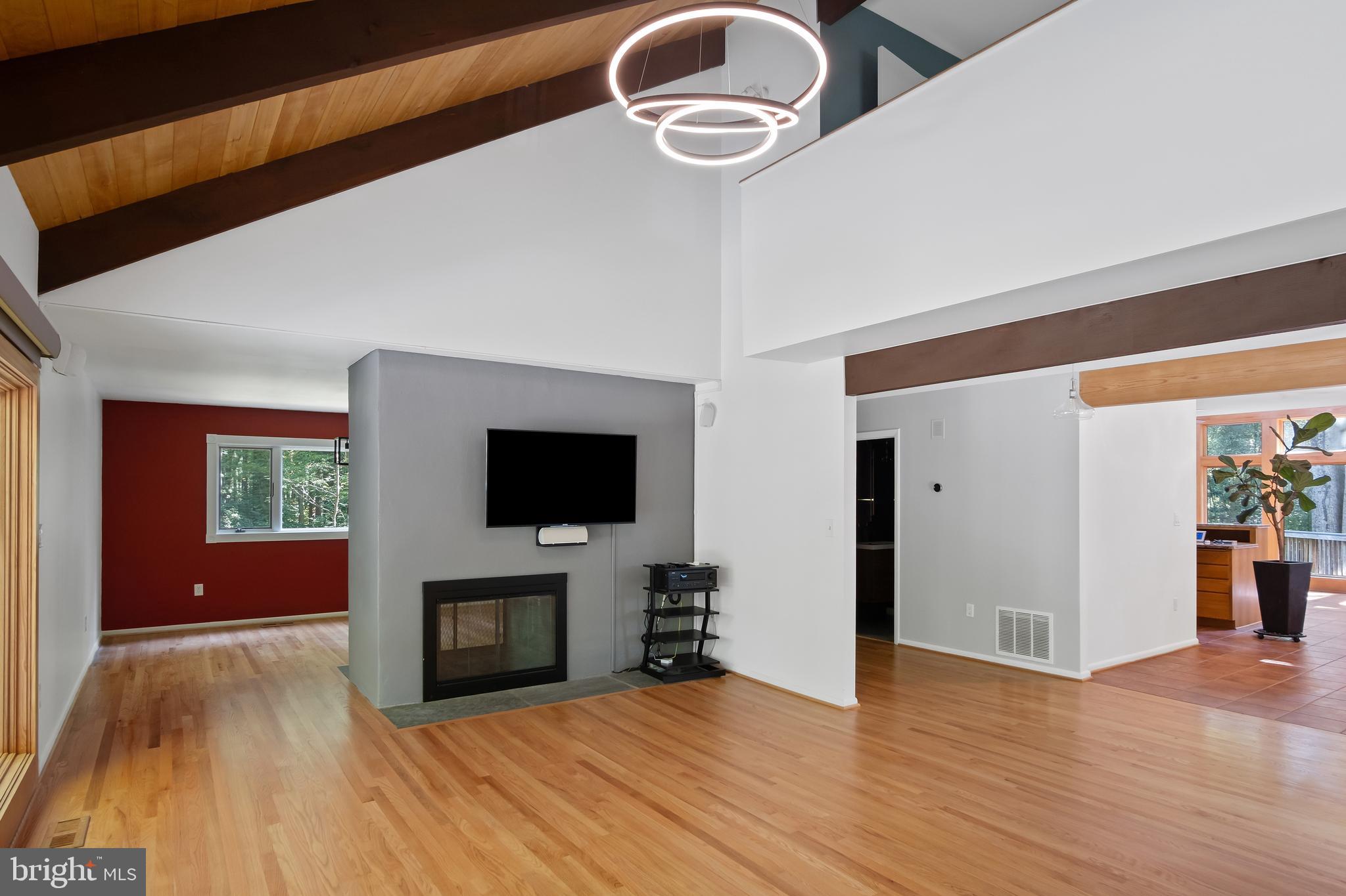 634 Springvale Road Great Falls, VA 22066 - Photo 30 of 67 a view of livingroom with hardwood floor and a fireplace