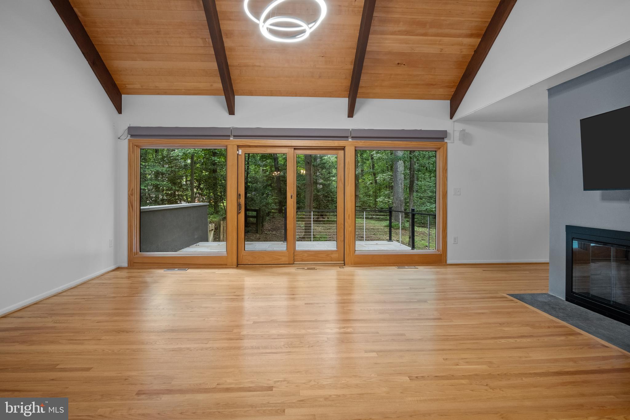634 Springvale Road Great Falls, VA 22066 - Photo 32 of 67 a view of an empty room with a fireplace and a window