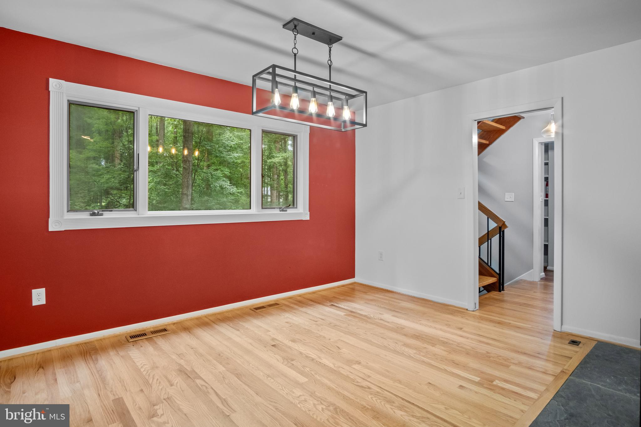 634 Springvale Road Great Falls, VA 22066 - Photo 39 of 67 a view of an empty room with wooden floor and a window