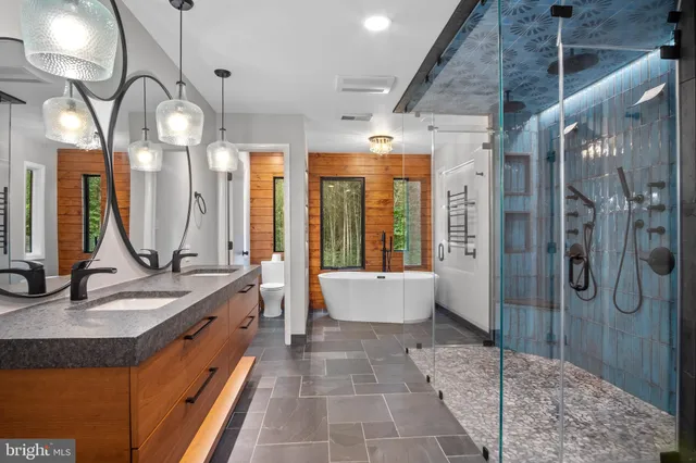 a bathroom with a sink and shower