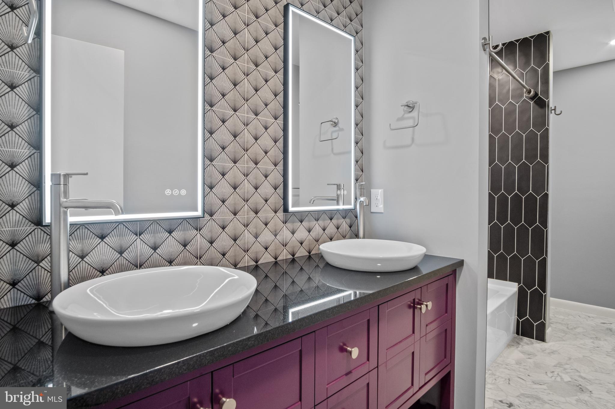 634 Springvale Road Great Falls, VA 22066 - Photo 49 of 67 a bathroom with a sink and a mirror