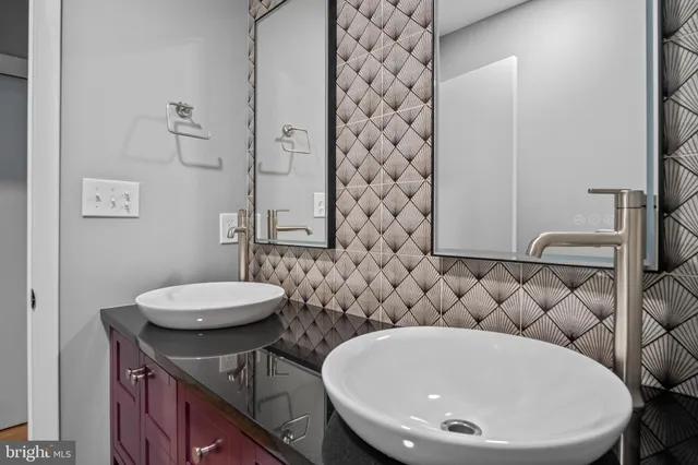 a view of a hallway with wooden floor and stairs