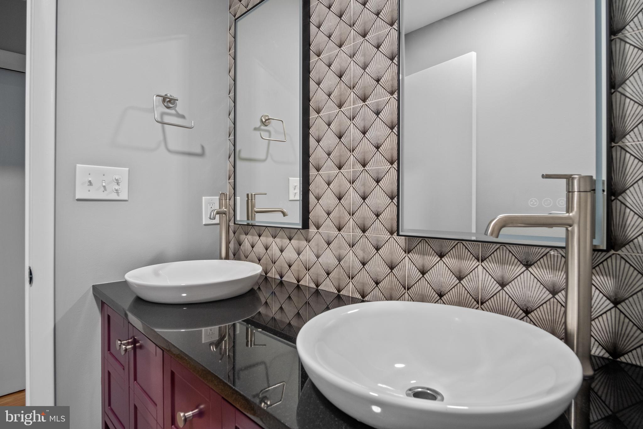 634 Springvale Road Great Falls, VA 22066 - Photo 50 of 67 a bathroom with a sink a toilet and shower