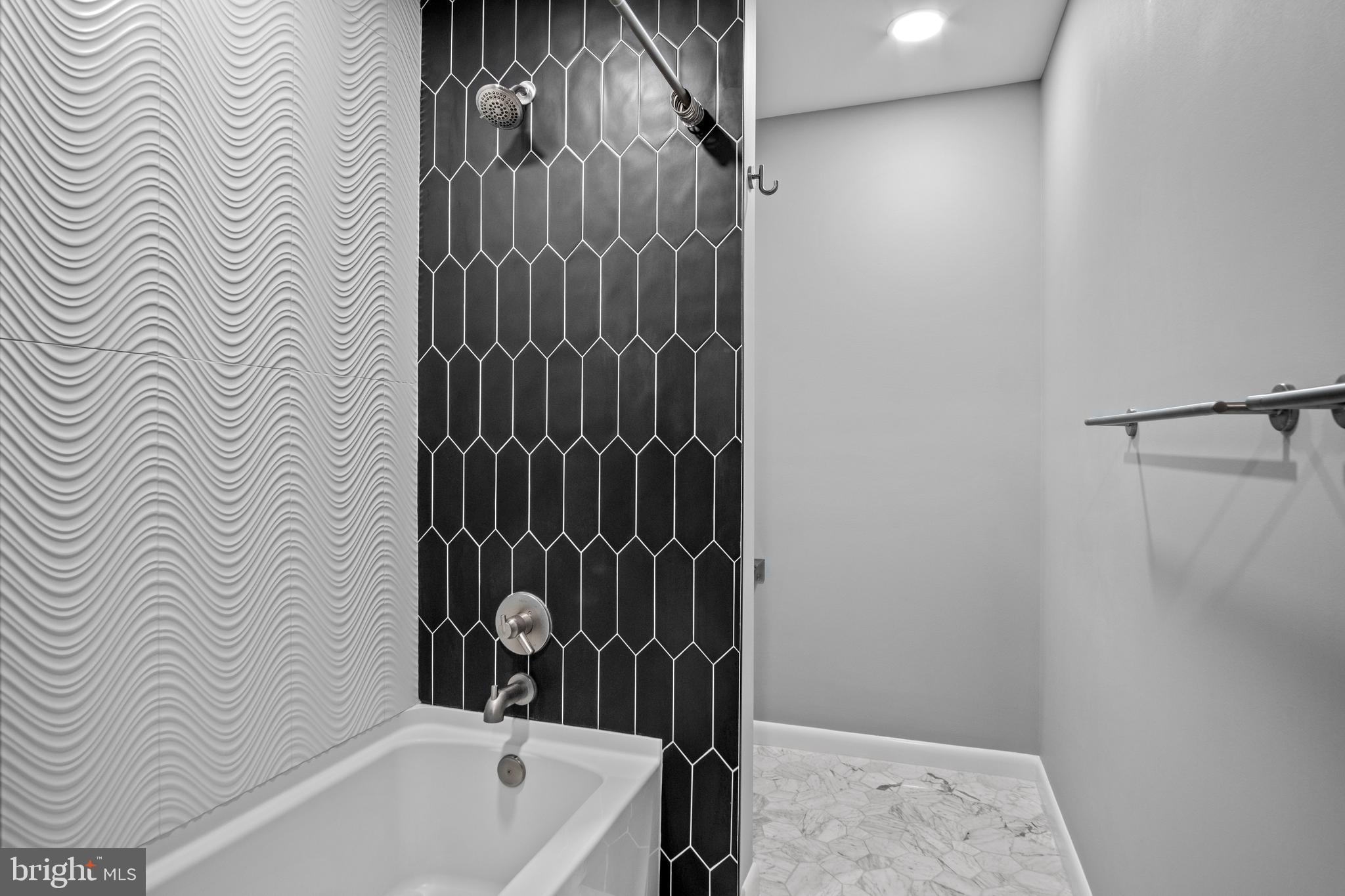 634 Springvale Road Great Falls, VA 22066 - Photo 52 of 67 a bathroom with a bathtub and shower