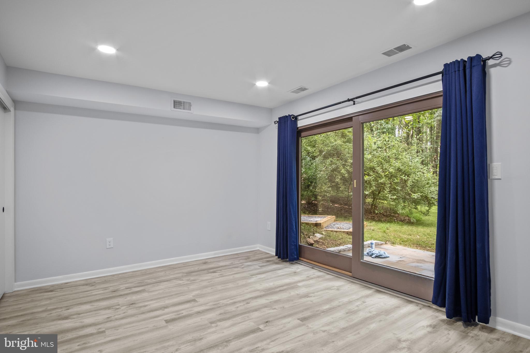 634 Springvale Road Great Falls, VA 22066 - Photo 58 of 67 a view of empty room with wooden floor and doors