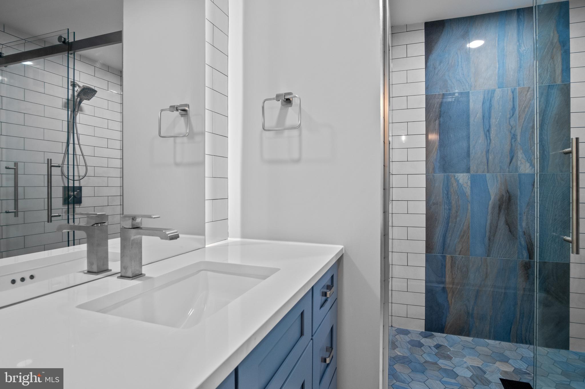 634 Springvale Road Great Falls, VA 22066 - Photo 59 of 67 a bathroom with a sink and shower