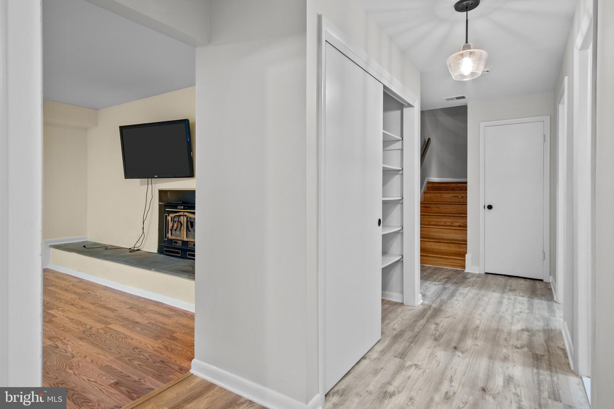 634 Springvale Road Great Falls, VA 22066 - Photo 61 of 67 a view of a hallway with wooden floor and staircase