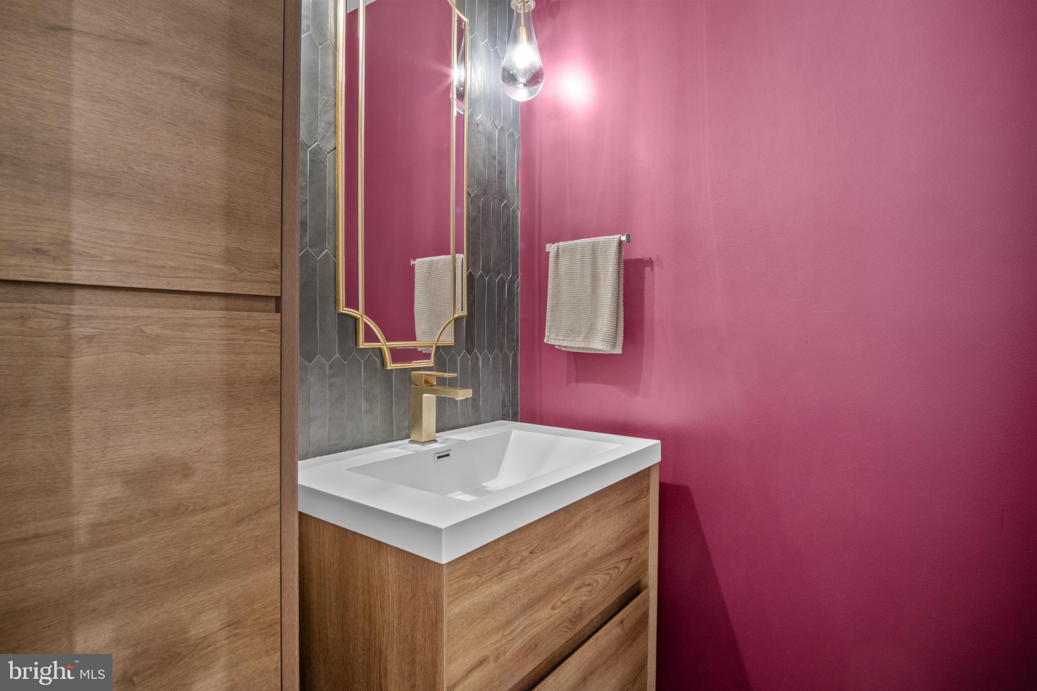 634 Springvale Road Great Falls, VA 22066 - Photo 65 of 67 a bathroom with a sink and a mirror