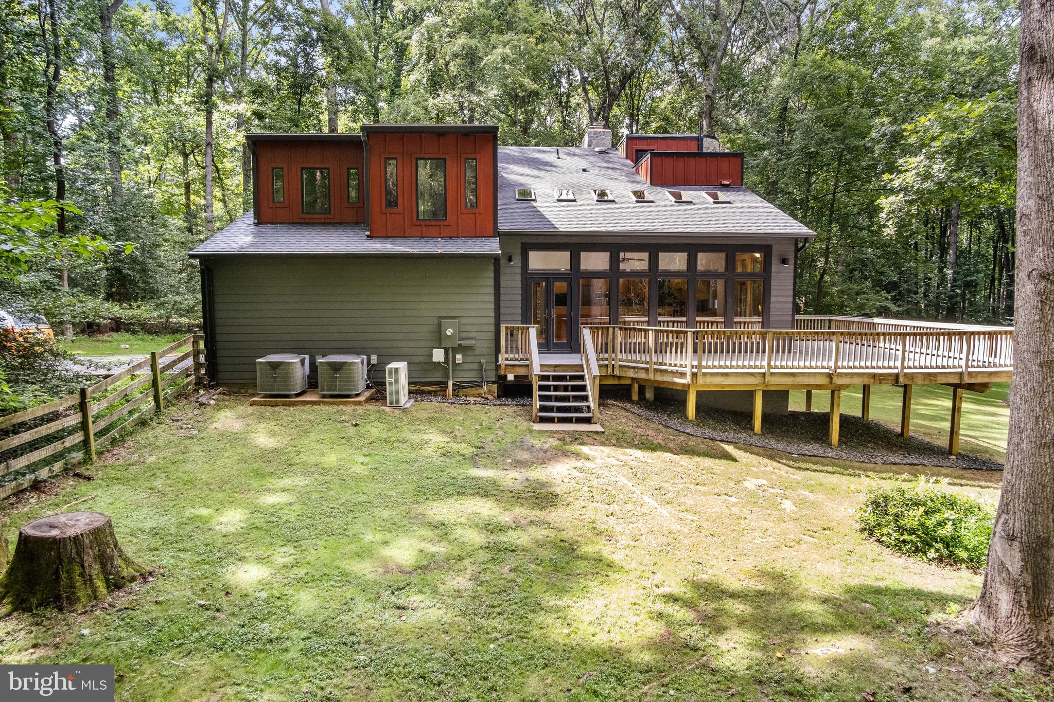 634 Springvale Road Great Falls, VA 22066 - Photo 8 of 67 a front view of a house with a yard table and chairs