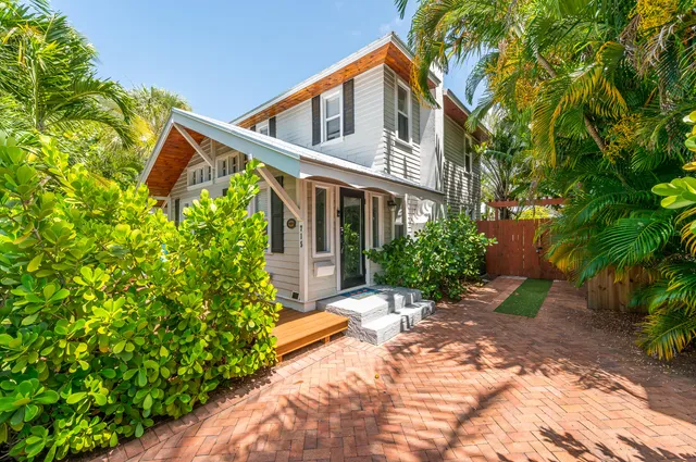 a view of a backyard with sitting area