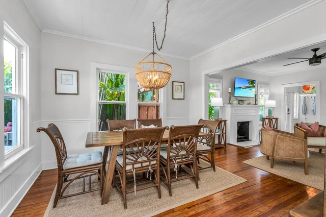 a kitchen with kitchen island granite countertop a stove top oven microwave and cabinets