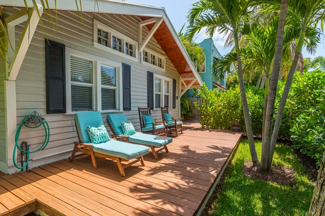 a front view of a house with sitting area