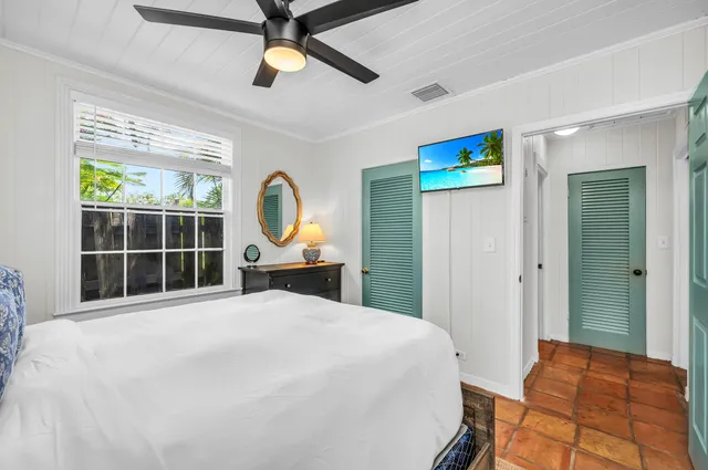 a bed room with a bed and a window