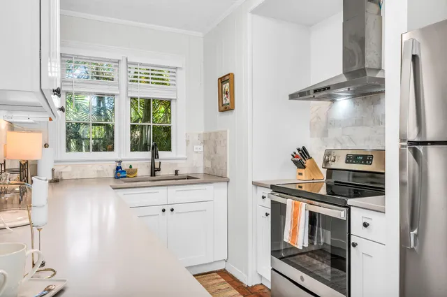 a view of a dining room with furniture wooden floor and chandelier
