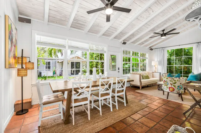 a bedroom with a bed and a flat tv screen on the dresser