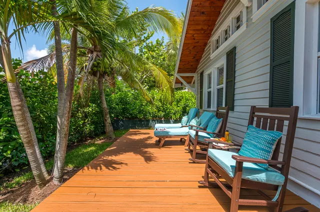 a living room with furniture and a painting on the wall
