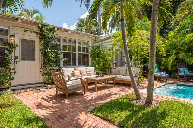 swimming pool with outdoor seating and yard