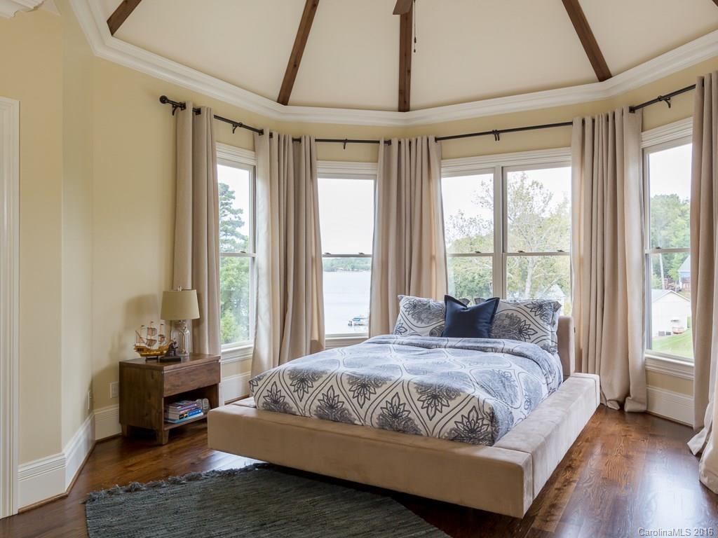 7099 Anchorage Lane Tega Cay, SC 29708 - Photo 12 of 24 a bedroom with a bed and a window
