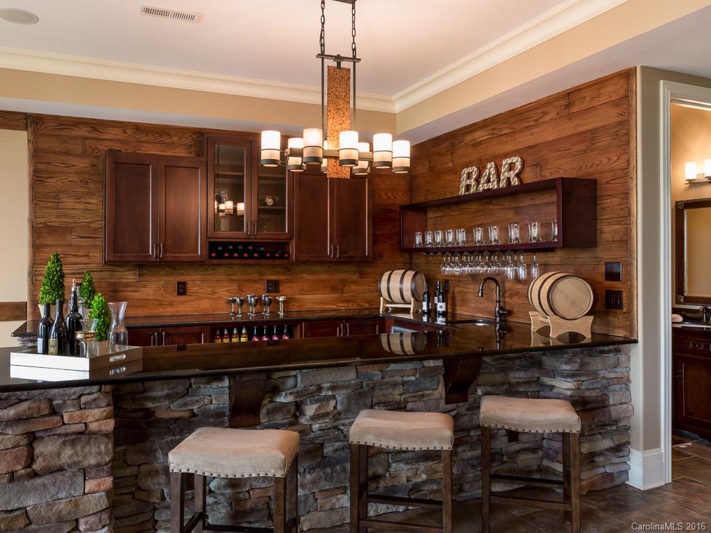 7099 Anchorage Lane Tega Cay, SC 29708 - Photo 17 of 24 a view of a chairs and tables in kitchen