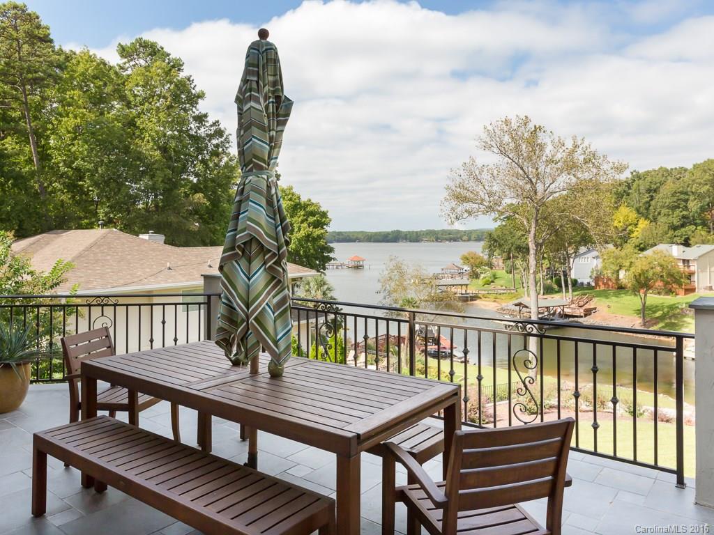 7099 Anchorage Lane Tega Cay, SC 29708 - Photo 21 of 24 a view of a balcony with two chairs and a table