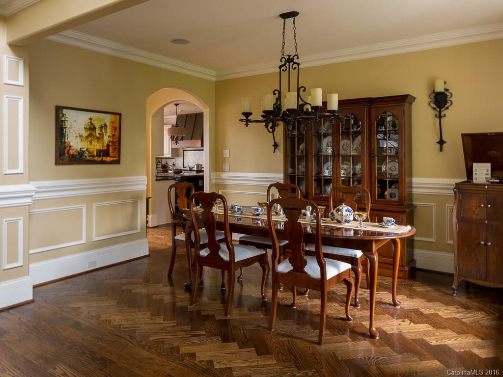 7099 Anchorage Lane Tega Cay, SC 29708 - Photo 7 of 24 a view of a dining room with furniture and chandelier