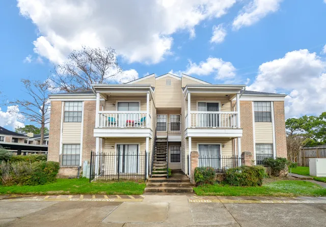 a front view of building with yard