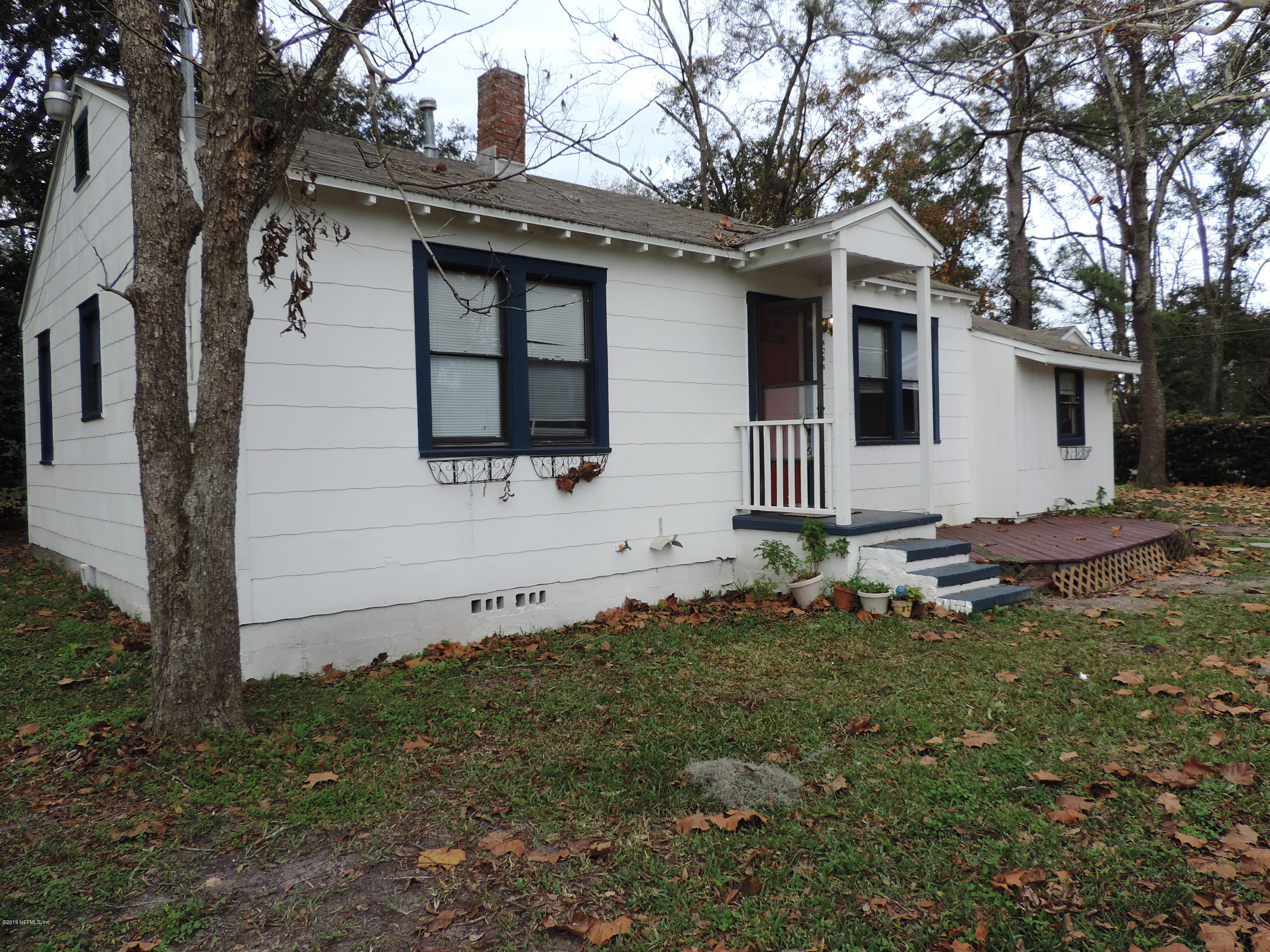 4244 Muncy Road Jacksonville, FL 32207 - Photo 1 of 19 a front view of a house with a yard