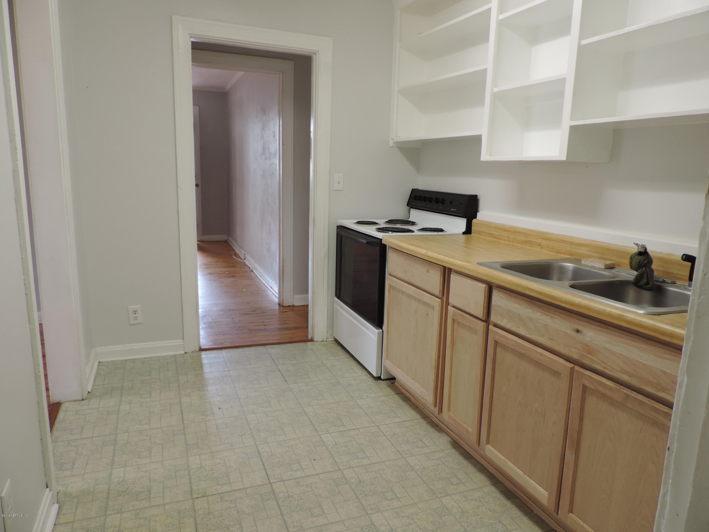 4244 Muncy Road Jacksonville, FL 32207 - Photo 11 of 19 a kitchen with a cabinets and white appliances