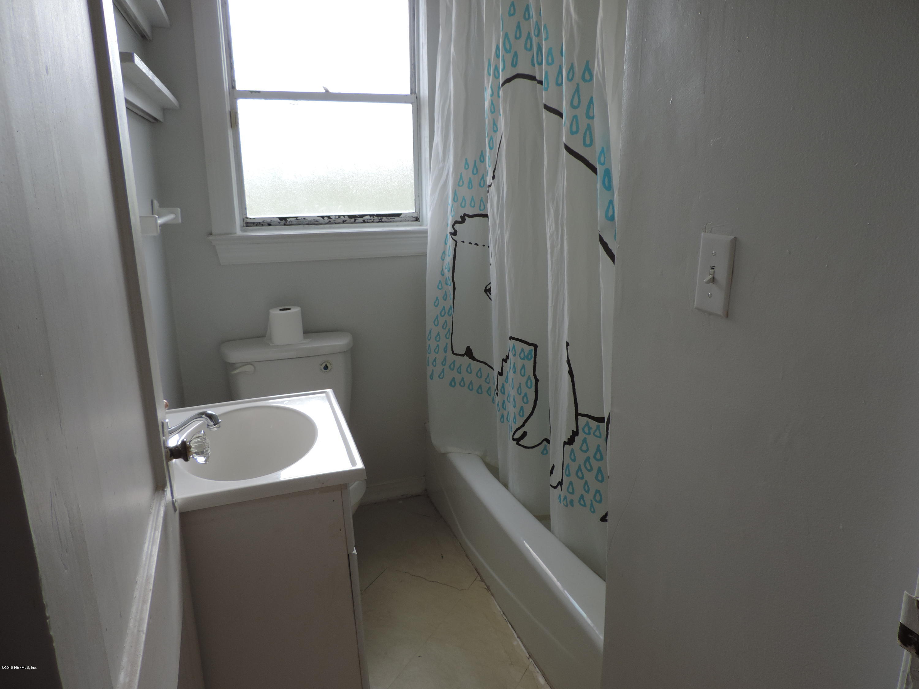 4244 Muncy Road Jacksonville, FL 32207 - Photo 13 of 19 a bathroom with a toilet sink and shower