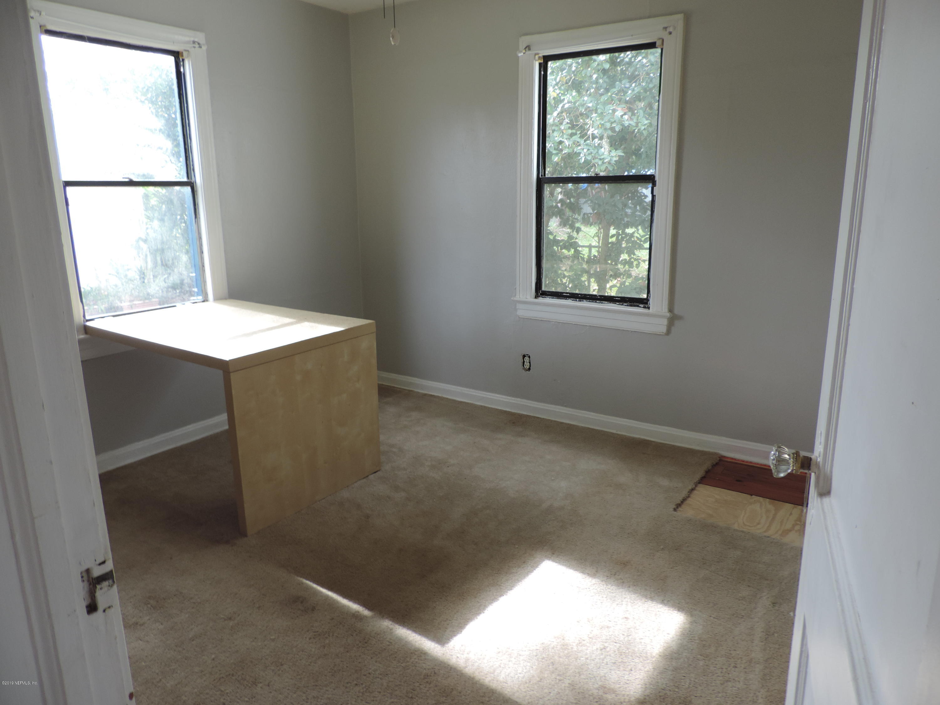 4244 Muncy Road Jacksonville, FL 32207 - Photo 14 of 19 a view of an empty room with a window