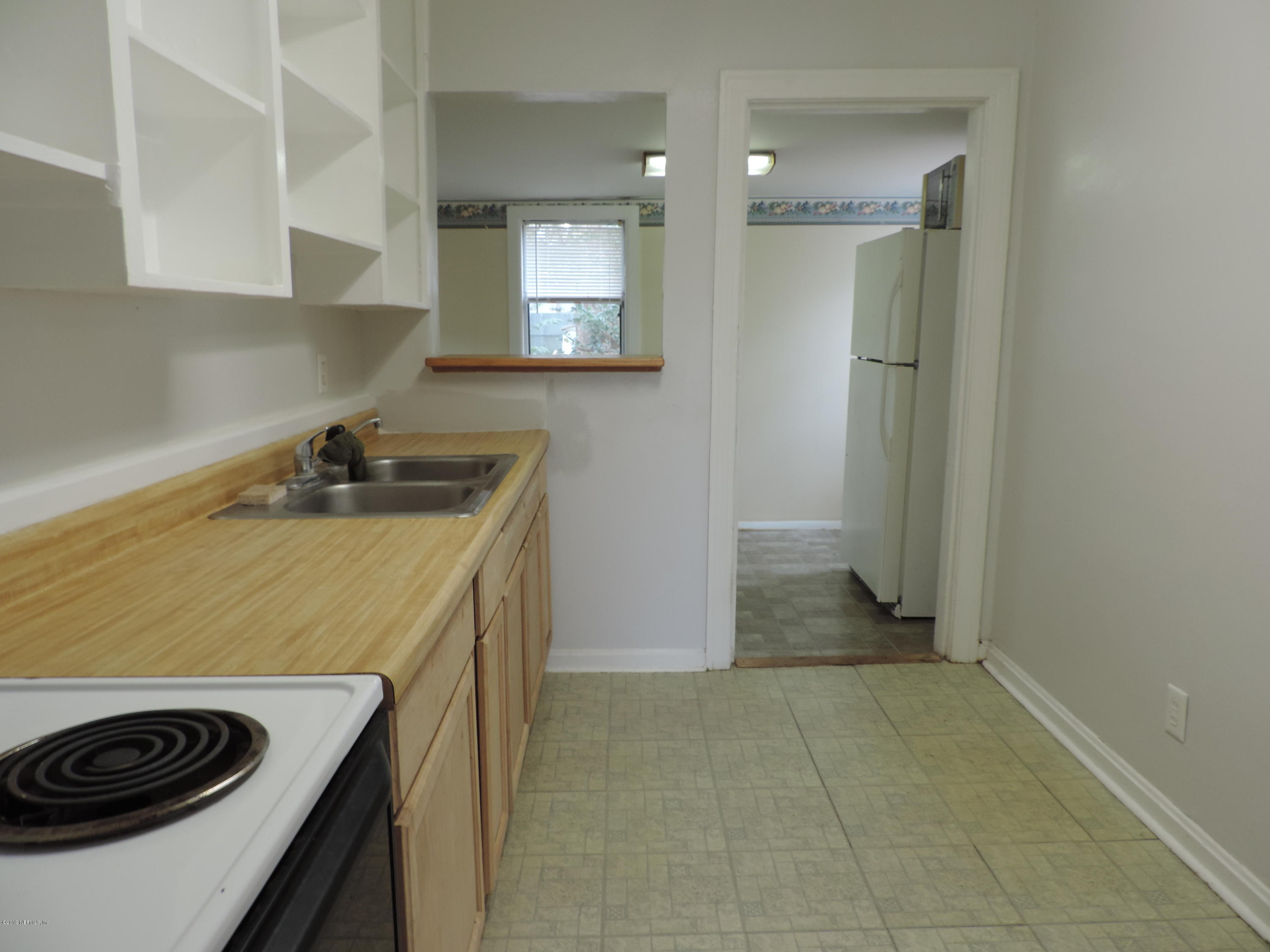 4244 Muncy Road Jacksonville, FL 32207 - Photo 10 of 19 a kitchen that has a sink and a stove