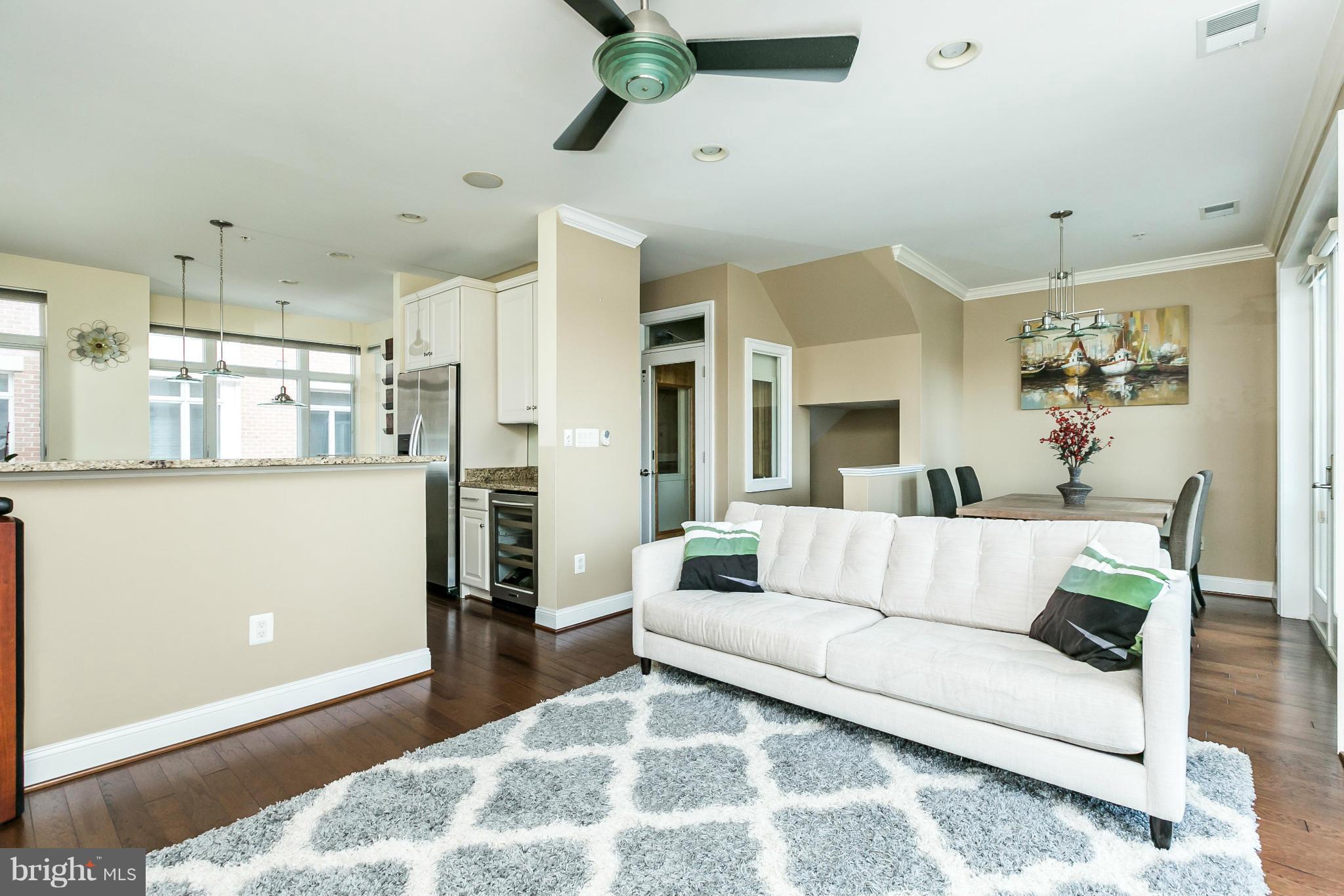 639 Ponte Villas South, Unit 128 Baltimore, MD 21230 - Photo 11 of 46 a living room with furniture and kitchen view
