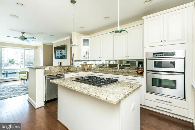 a kitchen with a sink stove and refrigerator