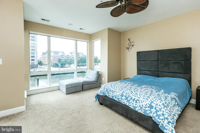 a bedroom with a bed dresser and a window