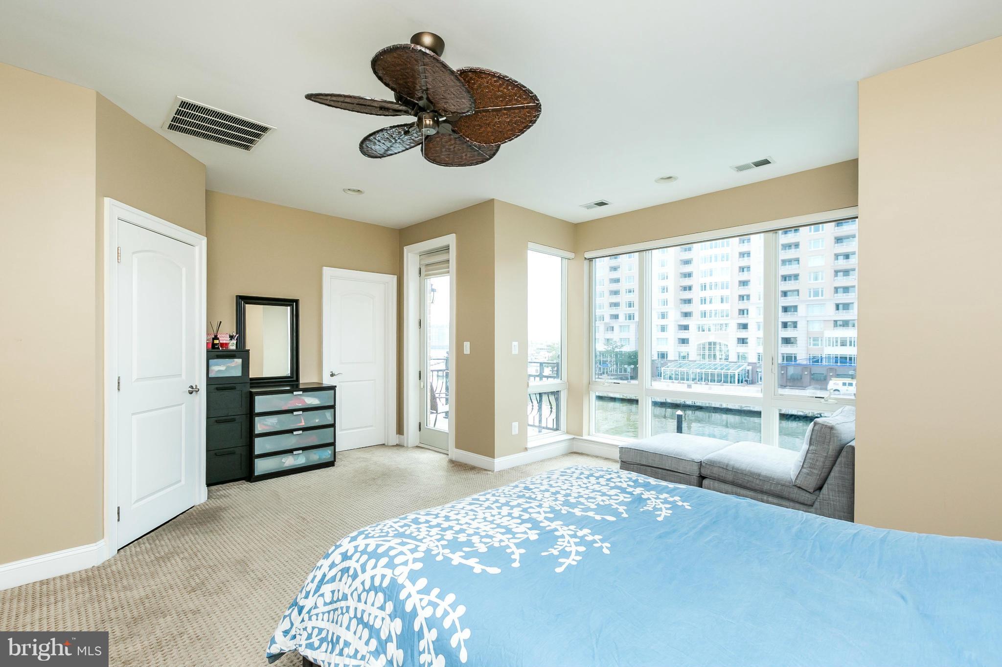 639 Ponte Villas South, Unit 128 Baltimore, MD 21230 - Photo 17 of 46 a bedroom with a bed dresser and a window