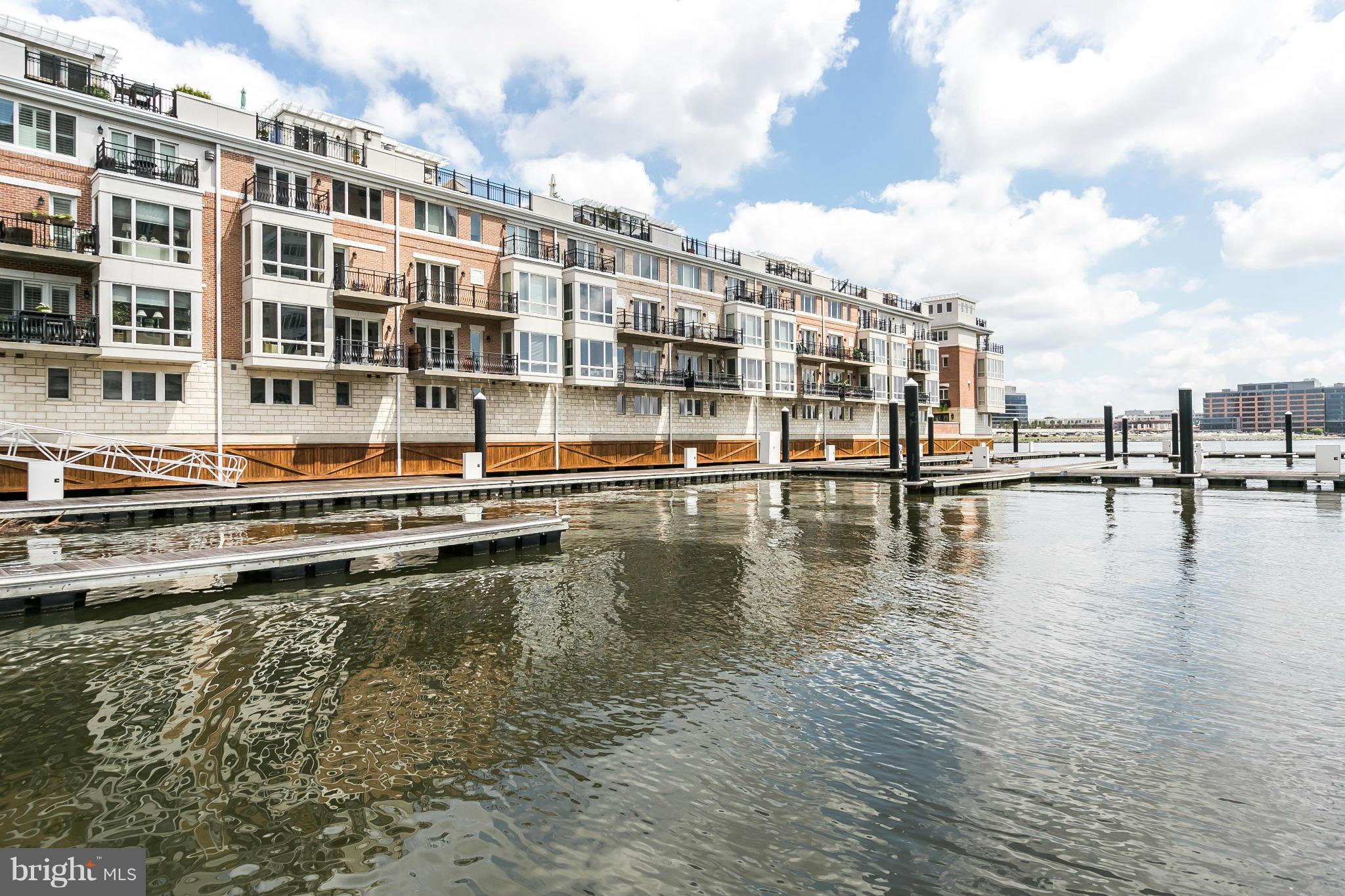639 Ponte Villas South, Unit 128 Baltimore, MD 21230 - Photo 28 of 46 a swimming pool view with a lake view