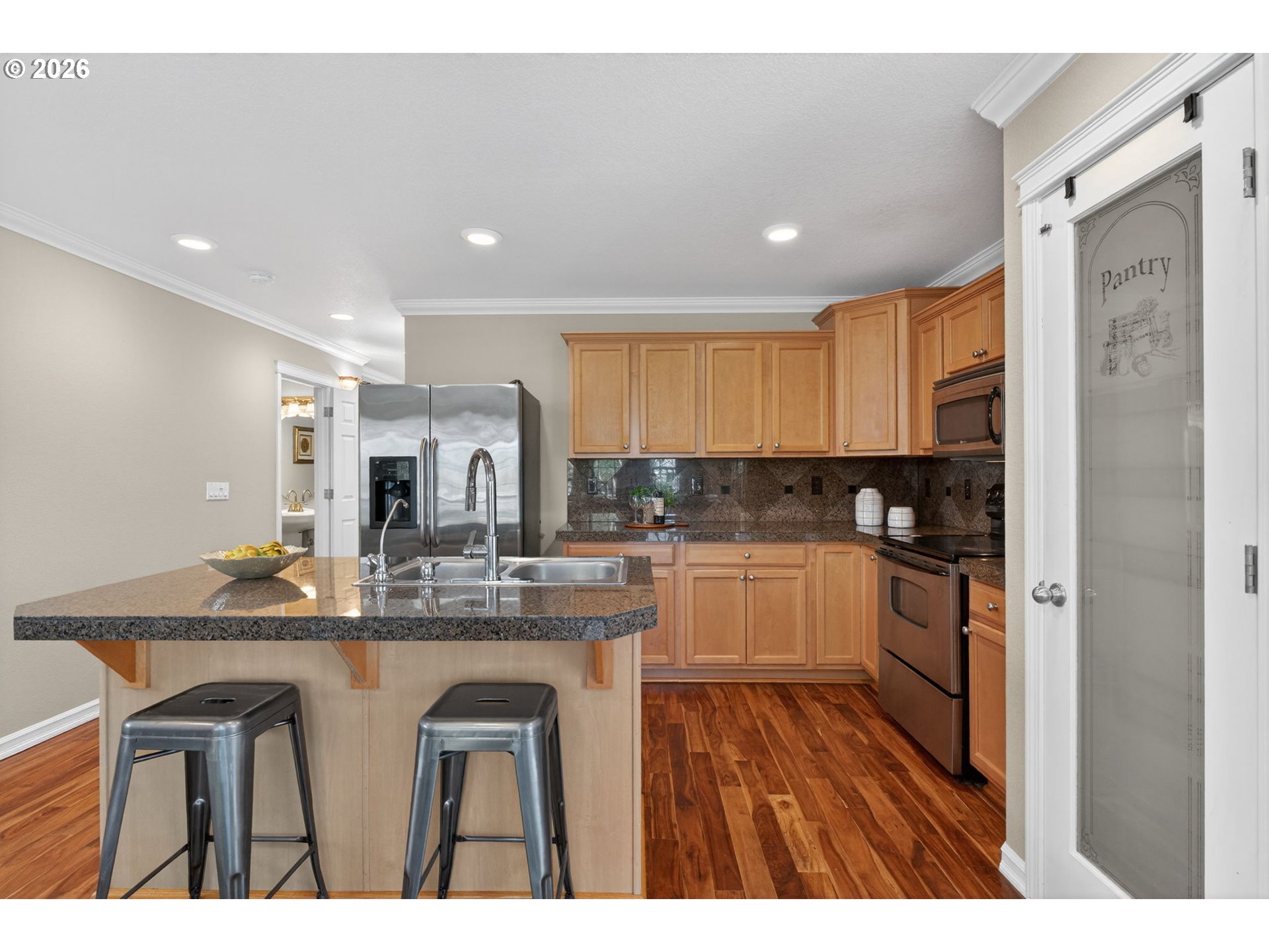 12619 Southeast Foster Road Portland, OR 97236 - Photo 11 of 48 a kitchen with kitchen island granite countertop a sink cabinets and stainless steel appliances