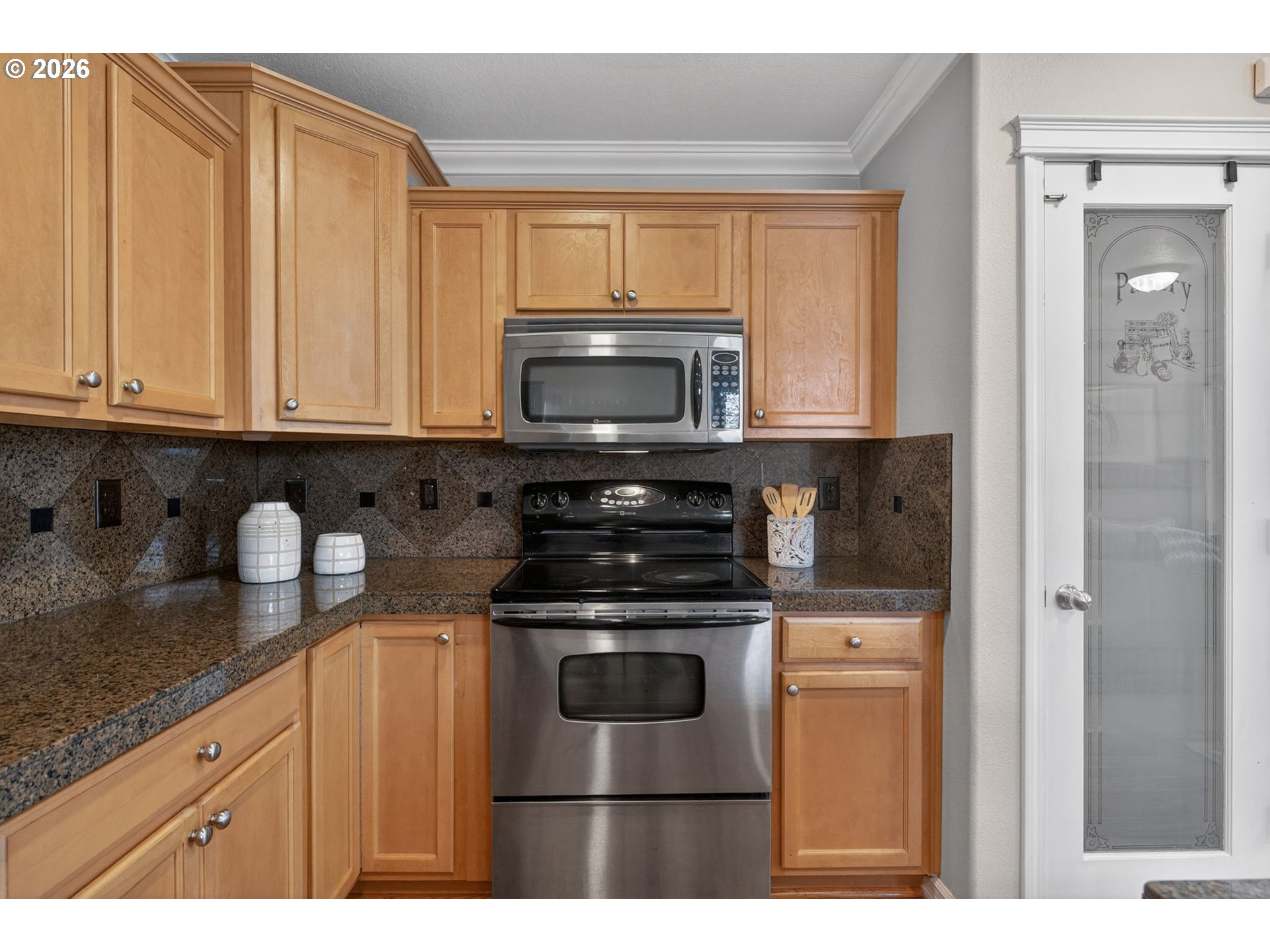 12619 Southeast Foster Road Portland, OR 97236 - Photo 12 of 48 a kitchen with stainless steel appliances granite countertop a stove a sink and a microwave