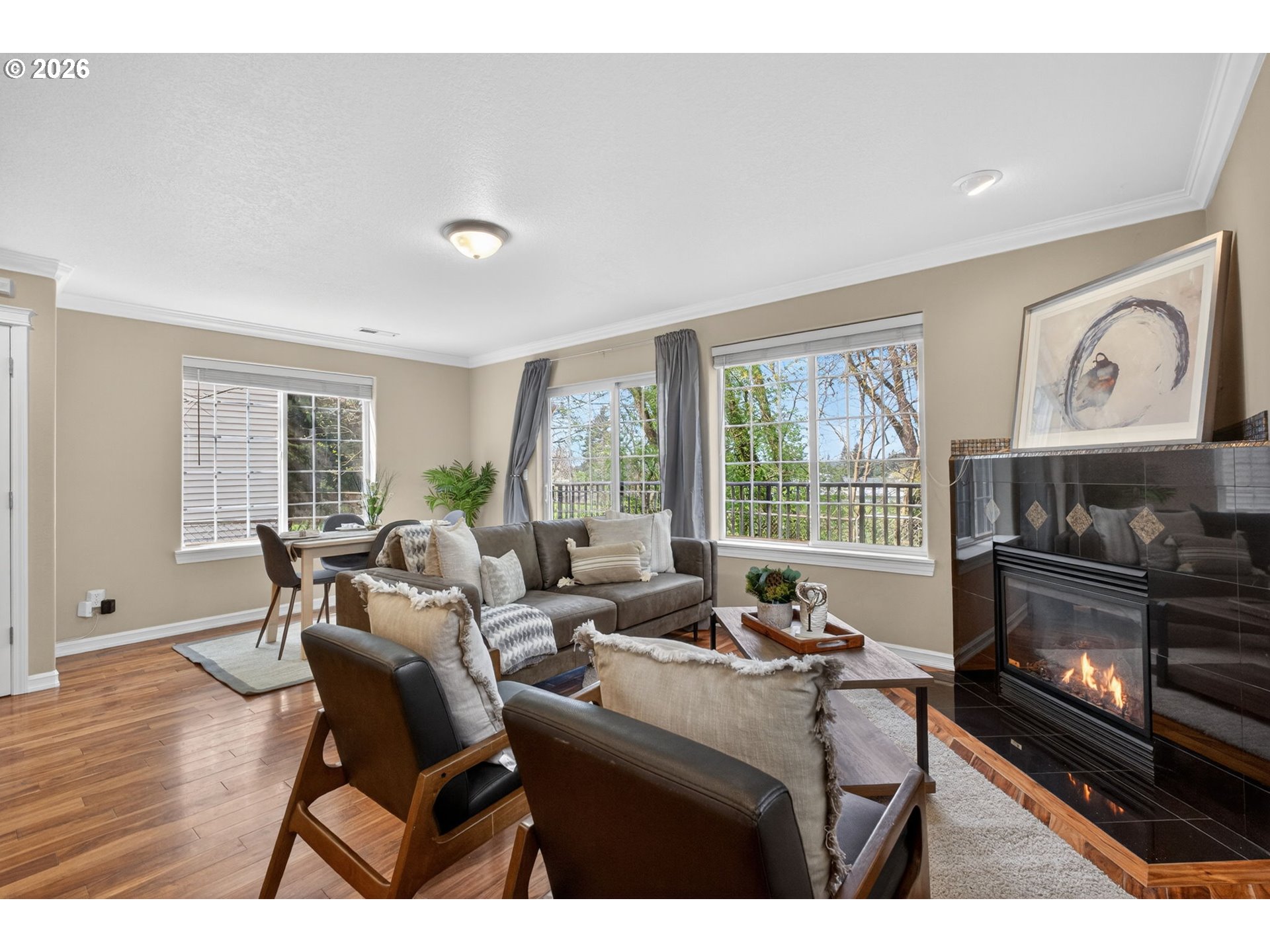 12619 Southeast Foster Road Portland, OR 97236 - Photo 21 of 48 a living room with furniture a large window and a fireplace