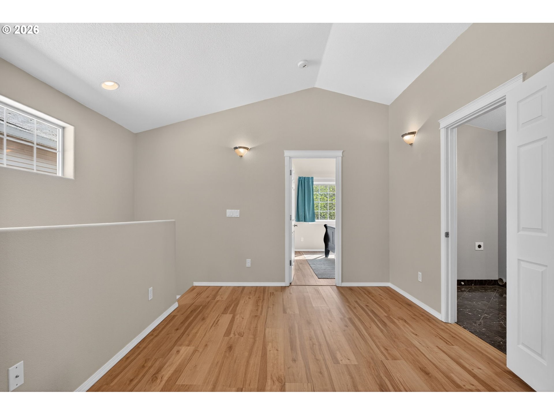 12619 Southeast Foster Road Portland, OR 97236 - Photo 23 of 48 a view of a room with wooden floor and a window
