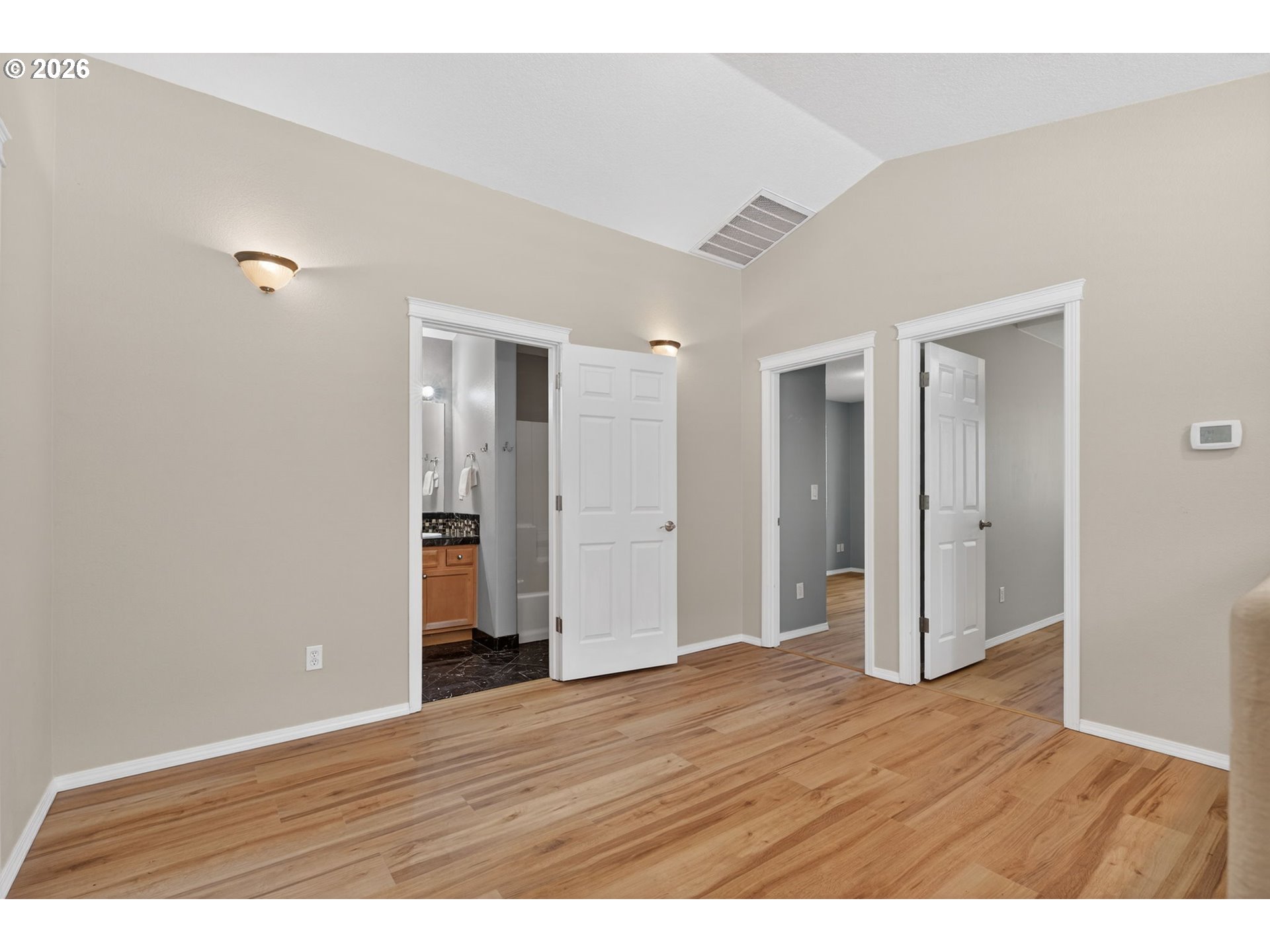 12619 Southeast Foster Road Portland, OR 97236 - Photo 24 of 48 a view of an empty room with wooden floor