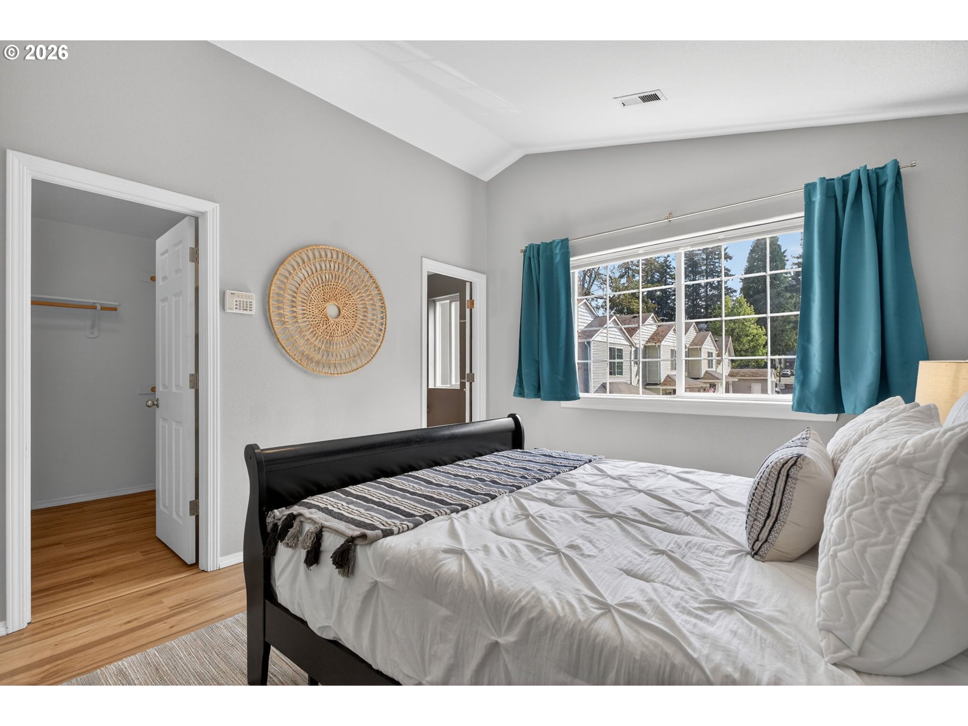 12619 Southeast Foster Road Portland, OR 97236 - Photo 26 of 48 a bedroom with a bed mirror and window