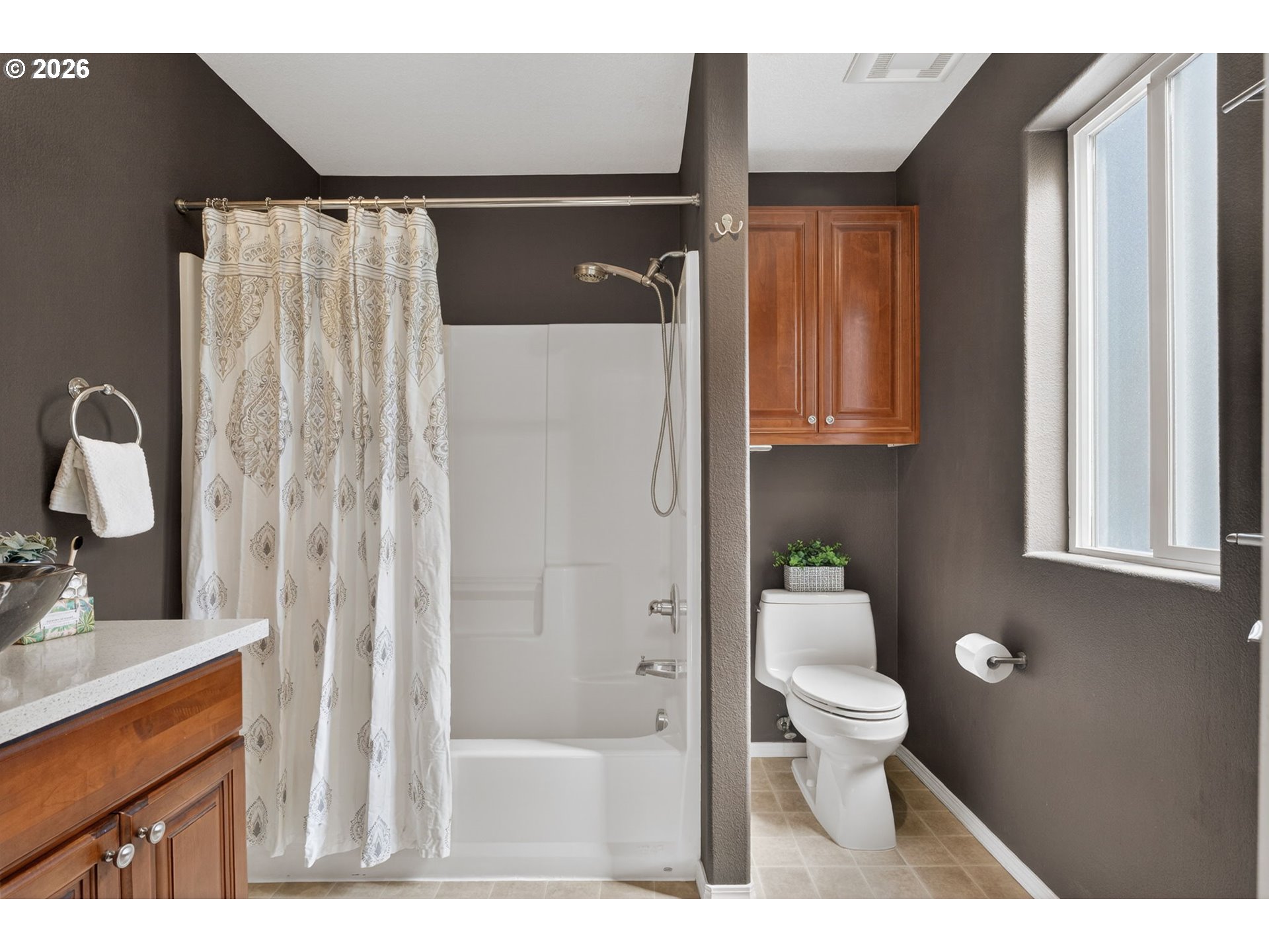 12619 Southeast Foster Road Portland, OR 97236 - Photo 28 of 48 a bathroom with a sink toilet and shower