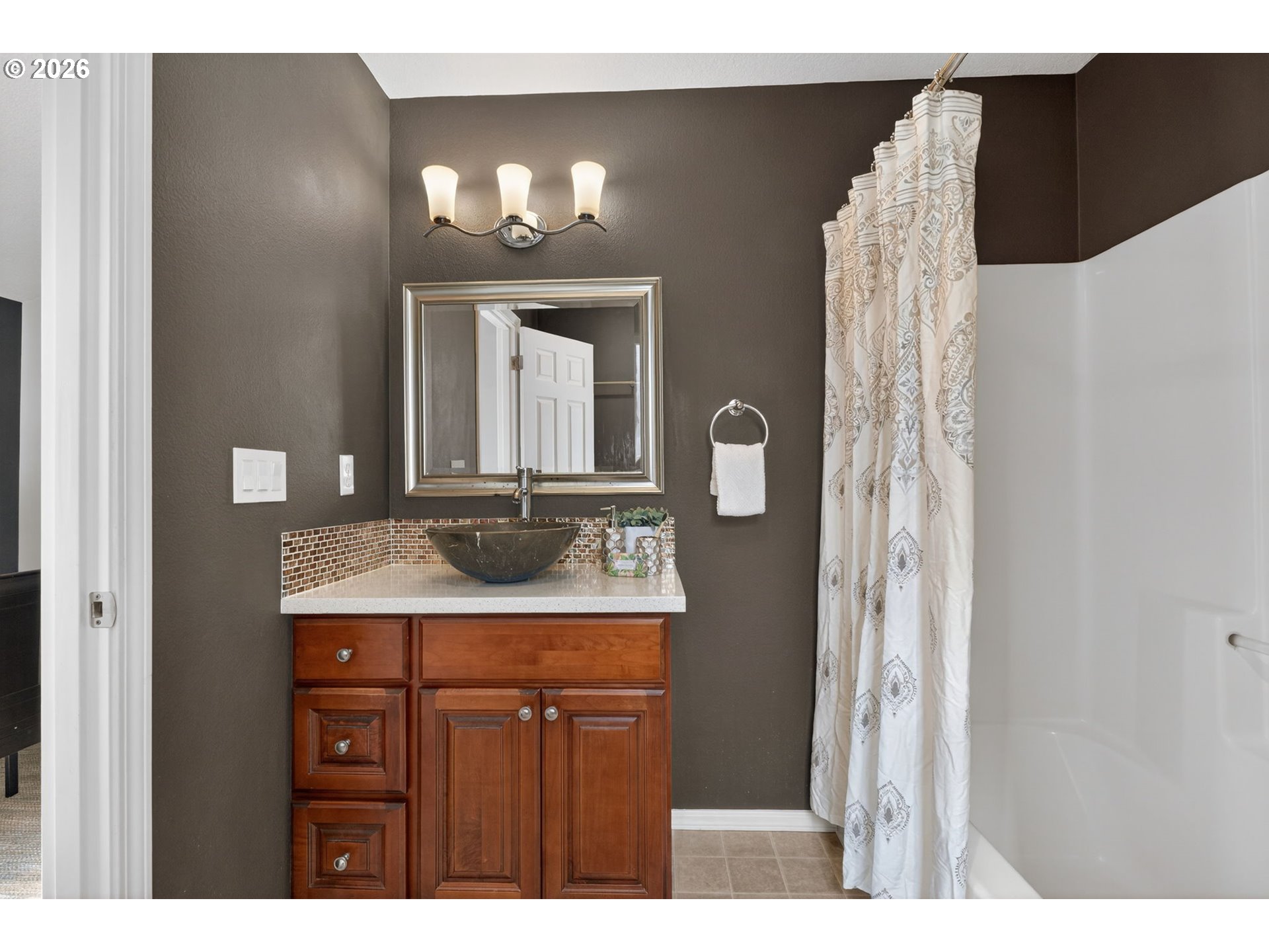 12619 Southeast Foster Road Portland, OR 97236 - Photo 29 of 48 a bathroom with a sink vanity and a mirror